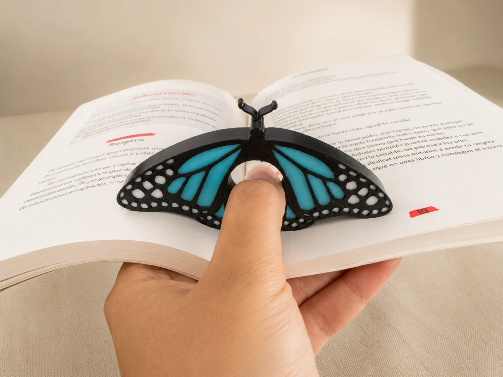 Sujeta libros mariposa 